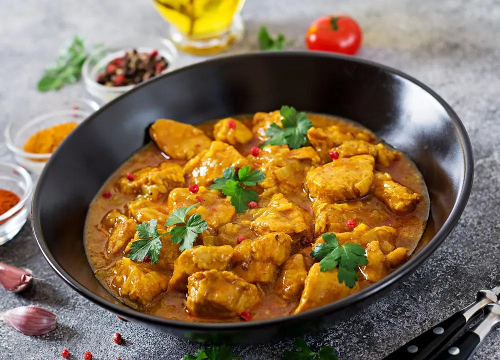 juicy chicken curry in a bowl